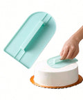 Cake cream surface smoother with handle on white background