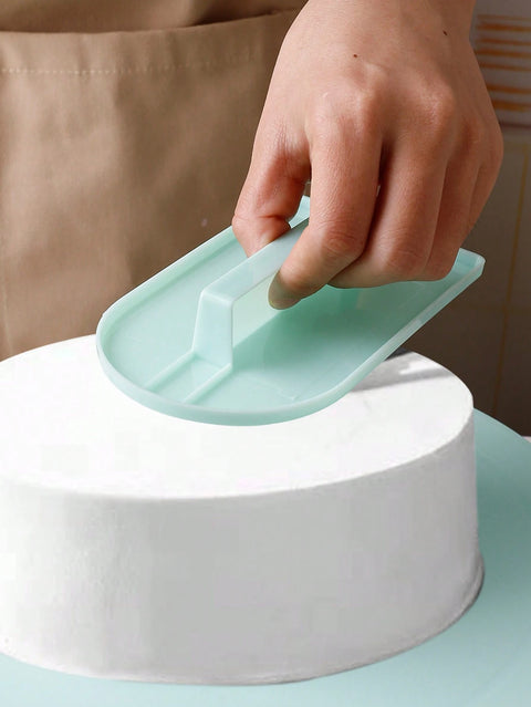 Smoothing buttercream on cake