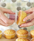 Cupcake Corer pressing into a cupcake Munchies Tools