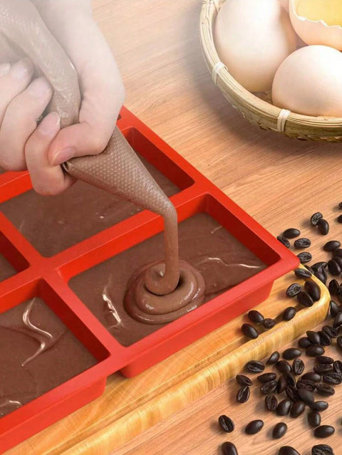 Filling silicone mini loaf mold with batter