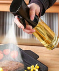 Spraying oil on grill