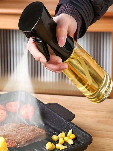 Spraying oil on grill