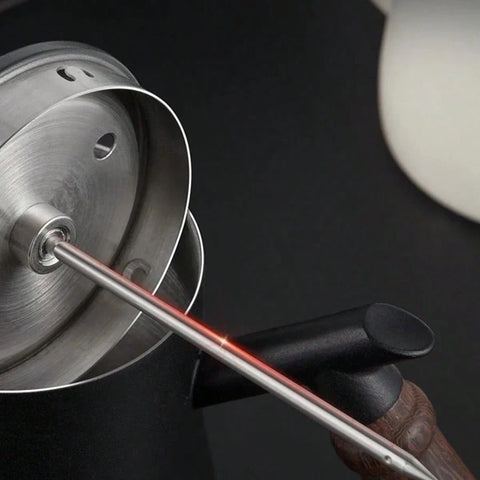 Thermometer probe in milk pitcher