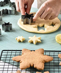 Cutting snowflake cookies