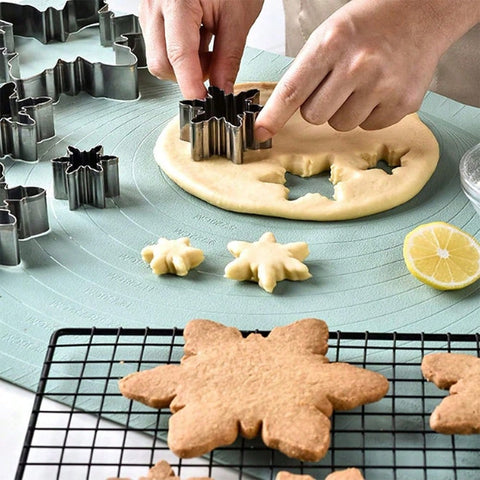 Cutting snowflake cookies