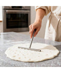 Spreading dough with T spreader