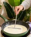 Spreading crepe batter in pan
