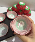 Santa cupcake liner in hand
