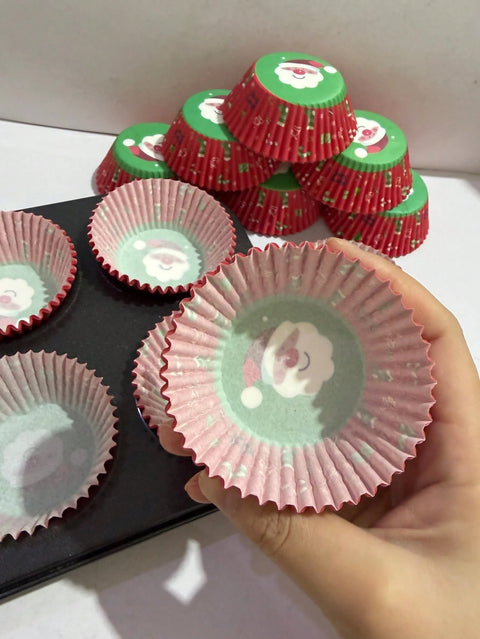 Santa cupcake liner in hand