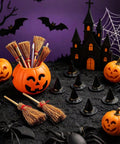 Mini brooms in a pumpkin