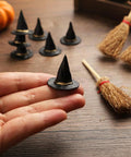 Mini witch hat in hand