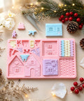 Pink gingerbread house mold with pieces