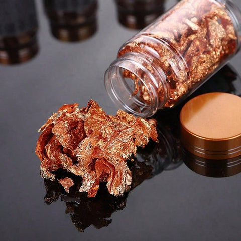 Gold foil flakes in use