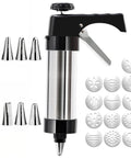 Cookie press with patterned discs and piping tips displayed on a white background
